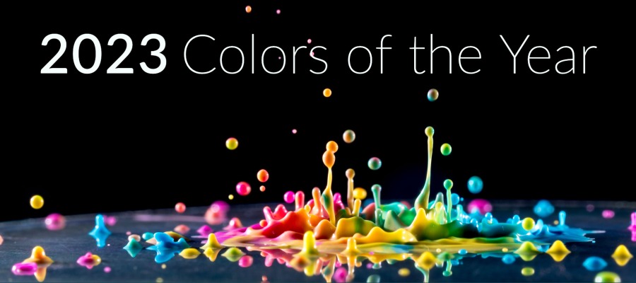 Photo of different colors of paint dropping onto a flat surface, text reads 2023 Colors of the Year.