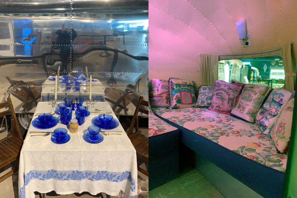 Two photos of vintage Airstreams. One shows a table set with china and candlesticks and the other shows an interior shot with a banquette and decorative souvenir pillows.