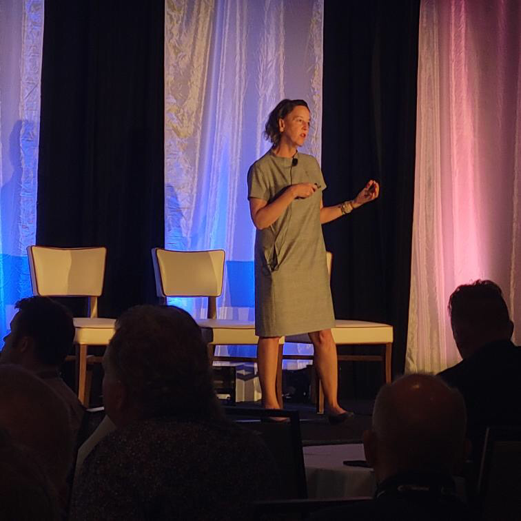 Kristen Dettoni on stage at the 2023 Wide-format Summit giving her presentation.