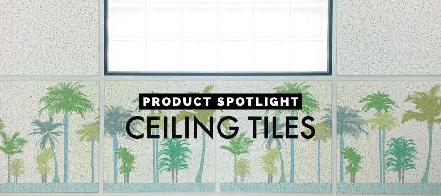 Looking up at ceiling tiles with a scene of trees