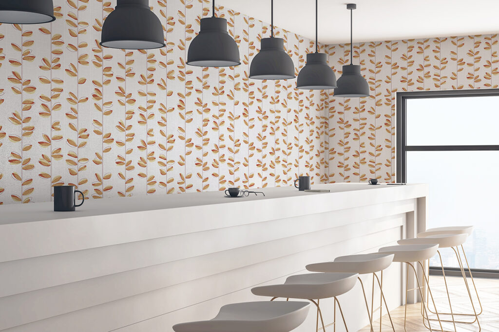 Mockup of a counter in a cafe with FabriTrak Systems walls with a watercolor vine pattern by Design Pool.