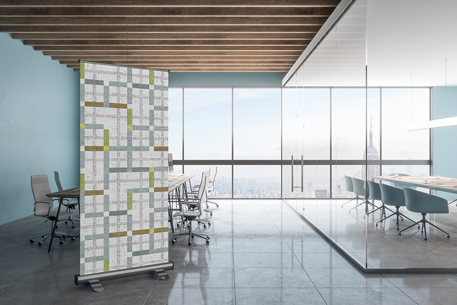 A mockup of an office with Design Pool pattern Modern Tartan on an acoustic room divider.