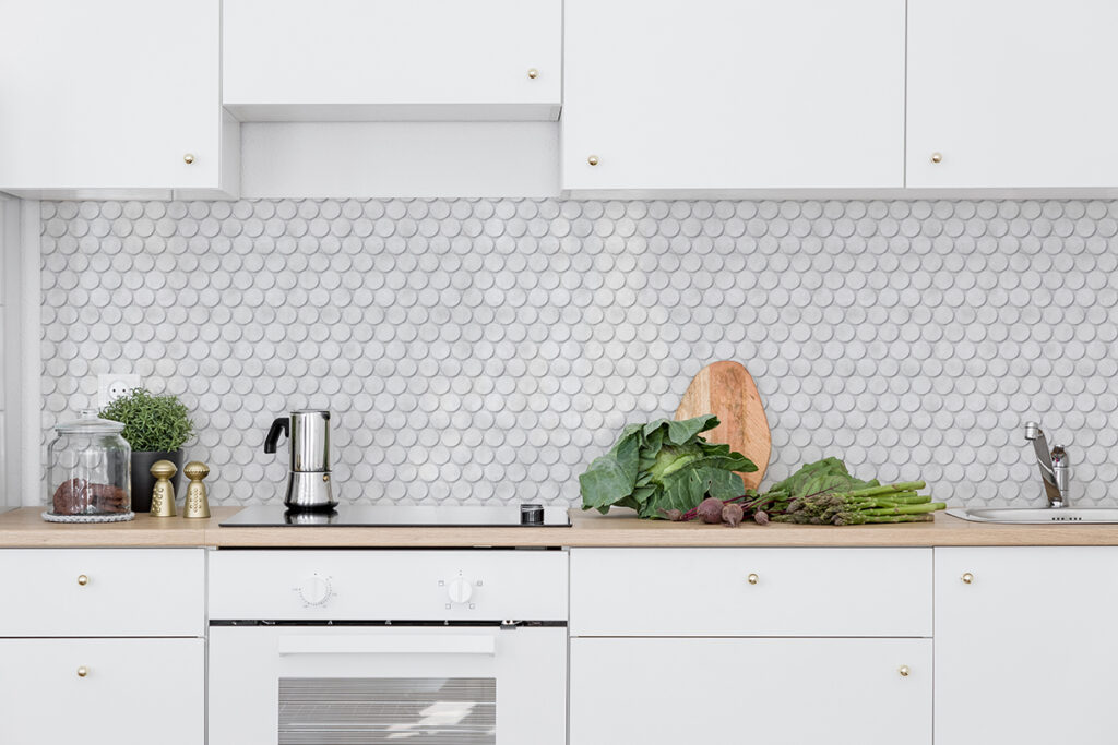 Mockup of kitchen with Design Pool pattern Penny Tile printed on wallpaper.