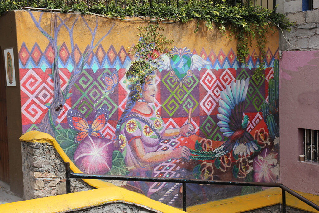 A photo of a mural in San Miguel de Allende of a weaver, taken by David Hansen.